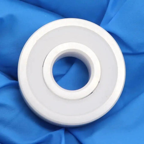 1PC 607 Full Ceramic ZrO2 Ball Bearing ABEC-9 Precision 7x19x6mm Double Sealed Dust Proof Skate Bearing on blue fabric backdrop.