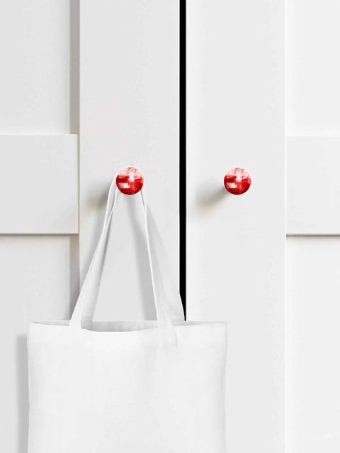 Solid 2 Piece Round Cabinet Knobs Crafted From Fine Beech Wood With Abstract Oil Painting Finish on white cupboard with bag.