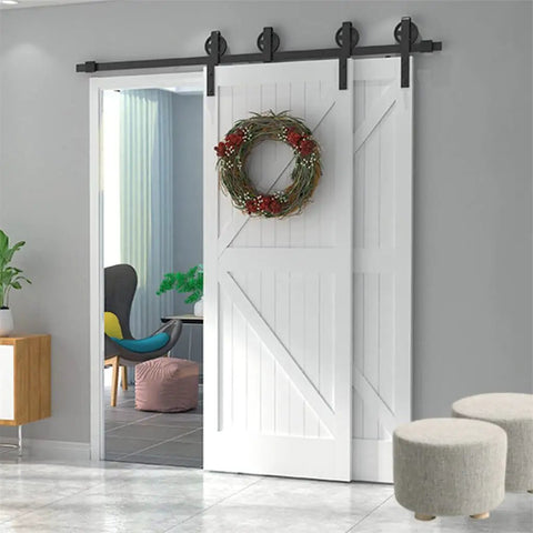 Modern Built Tough Double Sliding Barn Door Hardware Kit In Matte Black features oversized bearing wheels on white double doors.