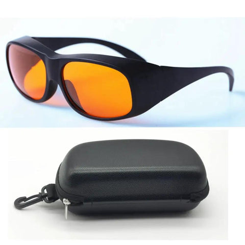 Badass Laser Safety Goggles For Blue And Green Beams Rock Solid Optics With Optical Density Five Shielding For Workshop Tasks And Precision Cutting in black with orange lenses and carrying case.