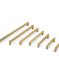 Various sizes of champagne bronze cabinet pulls shown in a row, highlighting modern square design and stainless steel finish.