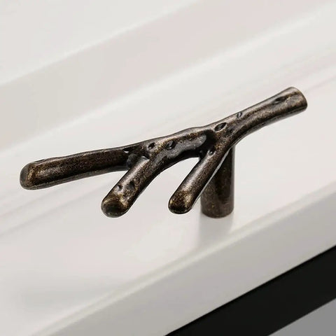 Hella Stylish Tree Twig Cabinet Knobs 6 Pack Bronze Zinc Alloy Drawer Pulls Solid Build For Mountain Cabin Kitchen Cupboard Single Hole Hardware With Screws on a white drawer.