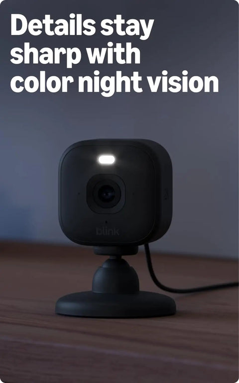 Mini 2K Plus Plug In Indoor Security Camera black unit on table showcasing night vision feature