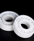 Pro Grade Zirconia Full Ceramic Ball Bearings With Next Level Heat Resistance And Beast Mode Operation For Grind Shop Machines And Hot Rod Builds 6314CE 70X150X35MM, detailed view of two white ceramic bearings.