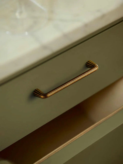 Close-up of 10 Pack Vintage Antique Brass Cabinet Pulls With An Exact 5 Inch Hole Center Solid Zinc Alloy Drawer Handles.