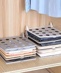 Slick Setup Folding Clothes Organizer Set For Quick T Shirt Folder Board With Stackable Clothing Dividers Stress Free Drawer Closet Storage For Zero Wrinkles And Easy Laundry on a shelf with neatly organized shirts.