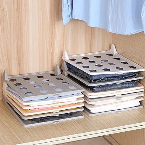 Slick Setup Folding Clothes Organizer Set For Quick T Shirt Folder Board With Stackable Clothing Dividers Stress Free Drawer Closet Storage For Zero Wrinkles And Easy Laundry on a shelf with neatly organized shirts.