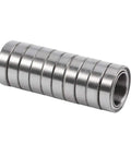 Super Prime Double Shielded Mini Ball Bearings For Tight Squeeze Equipment stacked in a compact row, measuring 10x15x4mm.