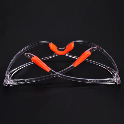 Rugged 4 Piece Set Of Anti Fog Safety Glasses Featuring Rock Solid Polycarbonate Shields And Soft Silicone Gaskets For Heavy Duty Workshop Protection Clear Impact Resistant Eyewear For Pros And Crew with orange accents.