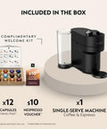 Vertuo Pop Plus Deluxe Coffee And Espresso Maker By DeLonghi in Black Matte with Dark Chrome shown with capsules and voucher