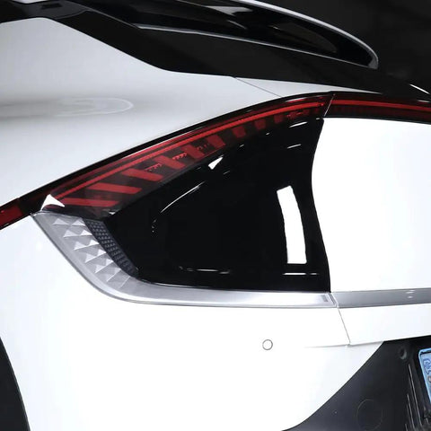 Badass Slick EV Charging Port Panel Trim Cover For Hyundai Kia EV6 2022 To 2026, close-up view on rear tail light.