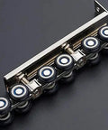 Rock Solid Zinc Alloy Window And Sliding Door Rollers Butter Smooth Ride 12 Wheel Double Nylon Pulleys Heavy Duty on a silver frame.