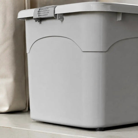 Heavy Duty Stackable Storage Totes With Secure Hinged Lids And Smooth Rolling Casters Plus Reinforced Side Handles For Clutter Free Closet Organization And Dorm Spaces, gray plastic tote on shelf.
