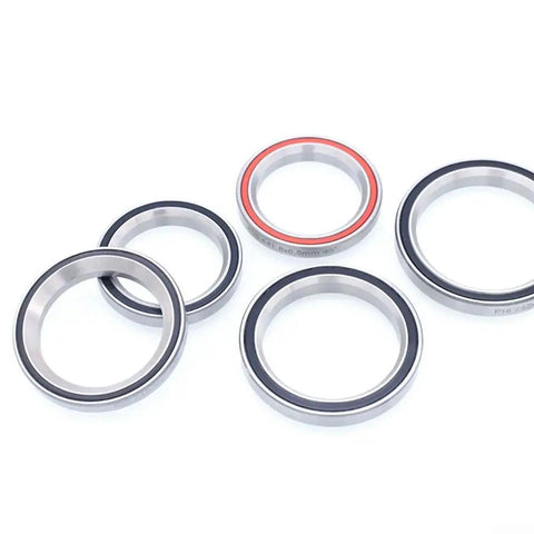 Sturdy Bicycle Headset Bearing Repair Kit For Mountain Bike With Beefy Steel Upper Bearing and various sizes of bearings.