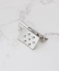 Silver metal crimp connector mounting clamp with eight holes for installing infrared heating foil