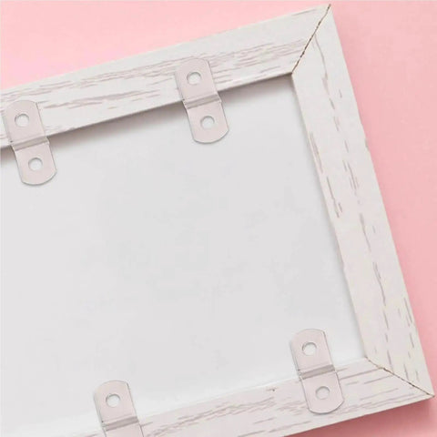 Heavy Duty Offset Canvas Clips 360 Pack For Picture Framing And Mirror Mounting Z Shaped corner brackets on a white frame.