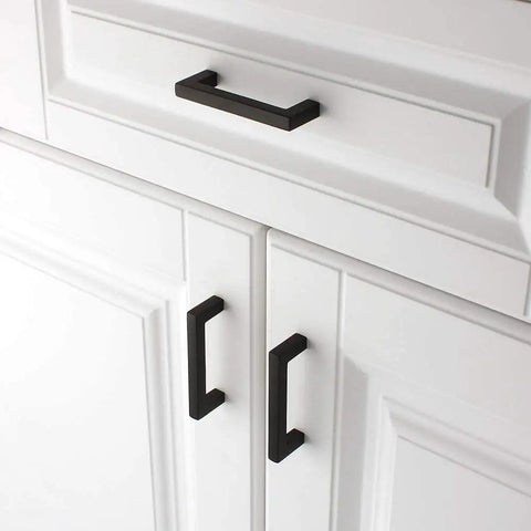 Heavy Duty Three Inch Matte Black Cabinet Pulls Square Bar Drawer Handles Solid Metal Cupboard Knobs Ten Pack installed on white cabinets.