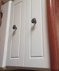 Antique Bronze Flower Knob Set For Cabinets And Drawers installed on white cabinet doors, featuring vintage flower design, 10 Pack included.