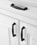 Grab These Sick Matte Black Cabinet Pulls Perfect For Any Renovation Vibe 10 Pack Of Rock Solid Drawer Handles with smooth rounded edges on white cabinet.