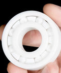 Top Tier Zirconia Full Ceramic Ball Bearings Run Ultra Fast And Stay Cool Under Load heavy duty single ceramic bearing in hand.