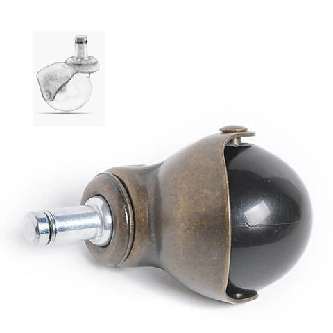 Four Slick Gliding Antique Bronze Swivel Casters Crazy Smooth Rollers For Office Desks And Workbenches With Quiet Locking Wheels Non Marring Carpet Safe No Hassle Replacement Gear close-up view of a bronze swivel caster wheel with black ball.