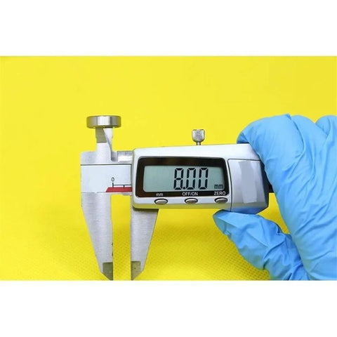 Measuring Heavy Duty Hybrid Ceramic Bearings 8x16x5mm Abec-1 with caliper showing 8.00mm reading on yellow background.