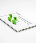 3 Pack SwitchLight LED Night Light For Single Pole Switches with green clips on white plate, auto on off sensor