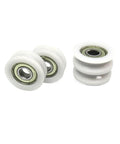 Rock Solid 2 Pack Delrin Pom Bearing Wheels With Slick Nylon Track Guide Rollers 8 mm Bore 40 mm Diameter Idler Pulleys for Tight Linear Motion Setups showing white wheels with metallic bearings.