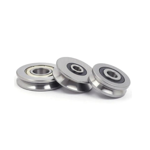 10 Pack Miniature Ball Bearings V Groove And U Groove Wire Guide Track Rollers in steel, 3 rollers with smooth surfaces.