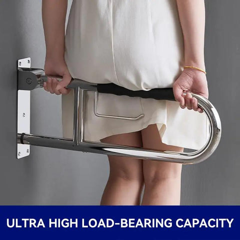 Solid 23.6 Inch Flip Up Toilet Grab Bar With Hella Secure Soft Silicone Anti Slip Grip And Built In Roll Holder Rock Solid 304 Stainless Steel U Shaped Safety Rail For Wet Bathrooms, mounted on wall, in use.