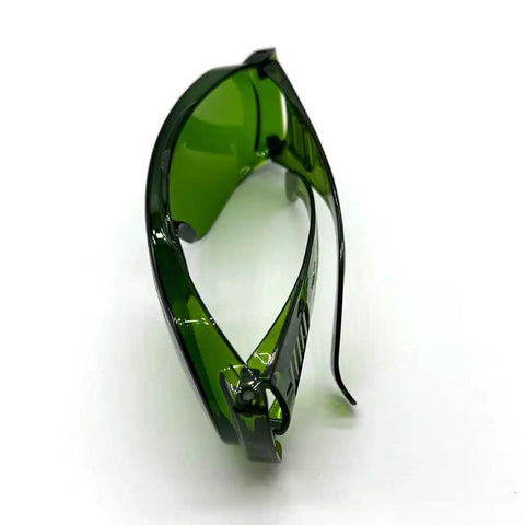 Badass OD5 Laser Protection Goggles Covering 190 To 470 Nm And 800 To 1700 Nm With Tough As Nails Shield side view with green lenses.