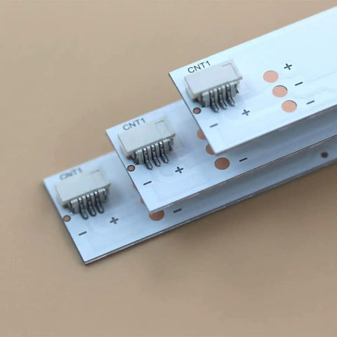 Close-up of connectors on 12 Pack LED Backlight Strips For TV LB70006 E70 E3 Replacement Kit, showing wiring details.
