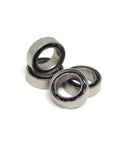 Miniature S6700C Hybrid Ceramic Ball Bearings 10x15x4mm Open Design with stainless steel rings in display.