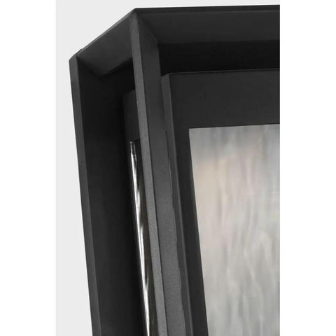 Next Level Urbandale Extra Large Outdoor Wall Lantern With Integrated LED And 2700K Warm Glow close-up detail of textured black edge and clear water glass.