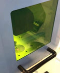 Top Drawer 1064nm Laser Safety Protection Window Heavy Duty Optical Viewer with green tint and ergonomic handle for workstation use.