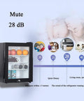 Compact Upright Mini Freezer Featuring A Sleek Black Glass Door With Energy Efficient Cooling That Runs Dead Quiet At Twenty Eight Decibels Ideal For Dorms Offices Or Small Bedrooms With Plug And Play Design with fruits and drinks inside.