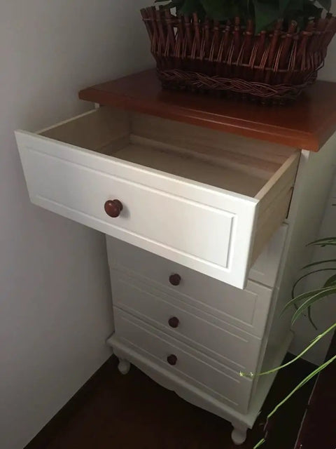 Ten Pack Round Wood Drawer Knobs Warm Red Brown Finish installed on white dresser with partially open drawer.