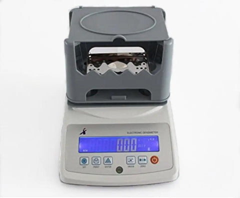 Knockout Precision Digital Density Meter That Slacks On Setup But Delivers Heavy Duty Gravimeter Results For Rubber Solid Granules And Thin Films With Zero Sweat Auto Calibration on a white background.