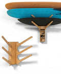Premium Bamboo Surfboard Wall Rack Stashes Three Boards For Gnarly Garage Gear Stash With Built In Tray and Secure Heavy Duty Hooks For Wake And Ski Display holding three surfboards.