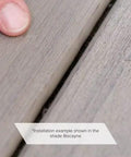 Quarter Inch Composite Decking Plugs In Pebble Grey compatible with standard plastic fastener systems shown during installation example.