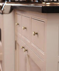 Champagne Bronze Round Cabinet Knobs Six Pack With Smooth Domed Top And Subtle Flared Base For A Polished, Modern Kitchen Look On Cabinets And Drawers, Easy To Install installed on kitchen cabinetry