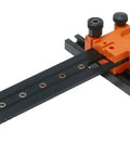 Aventos Universal Individual Boring Template For Cabinet Doors And Mechanisms, Pre Bore Locator Pins And Drilling Jig, black and orange tool.