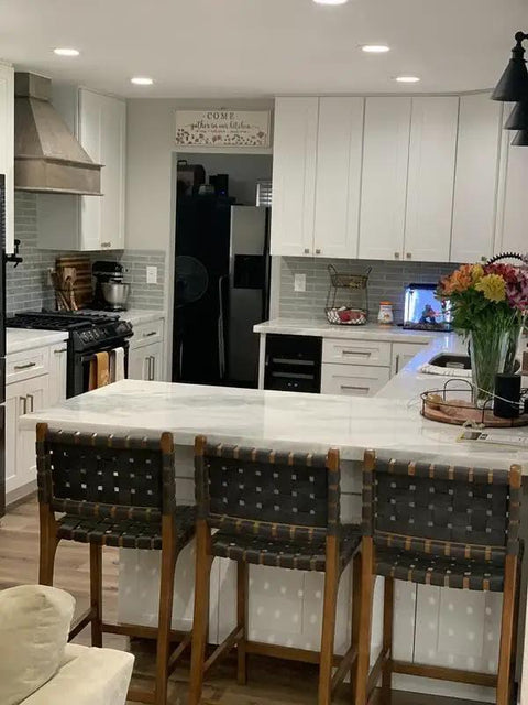 modern kitchen featuring a marble island and white cabinetry with 10 Pack Brushed Brass Cabinet Pulls And Heavy Duty Zinc Alloy Drawer Handles With Top Notch Vintage Gold Finish For Your Kitchen Cupboard And Dresser That Offer Dead Easy Install And Serious Style.