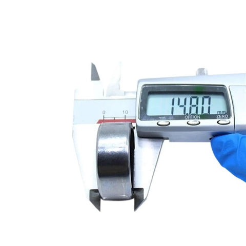 Heavy Duty Drawn Cup Needle Roller Bearing 282 By 352 By 148 Millimeters measured at 148mm using calipers for precision.