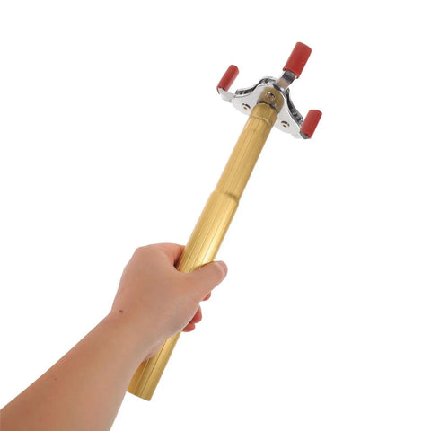 Ladder Free Smoke Sensor Assembly Removal Tool with a rock solid aluminum jaw being held, showcasing its sturdy grip.