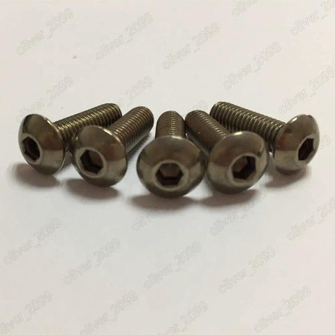 Top Tier Titanium Grade 2 Hex Socket Bolts And Button Head Cap Screws, ISO 7380 Certified Heavy Duty M6 x 35mm screws grouped on surface.