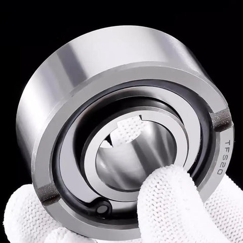 Built Tough One Way Clutch Bearing Engineered For Unidirectional Shaft Spin And Automatic Reverse Lockup On Worksite Machinery Keeps Your Gear Running Sweet Under Heavy Duty Loads Size 25X52X15, held in a gloved hand.
