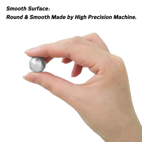 Person holding a round stainless steel forging ball from the Top Shelf Stainless Steel Forging Balls Assortment for custom coin ring making.