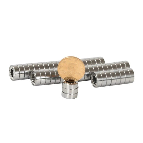 Premium Stainless Steel Deep Groove Ball Bearings Miniature Smr63zz with ZZ Shields, showing a stack with a coin for size reference.