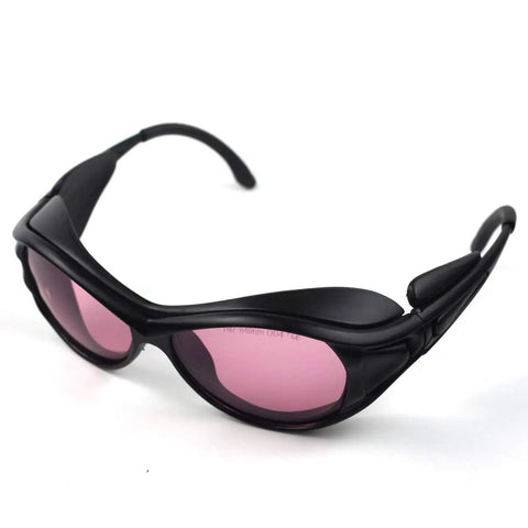 Heavy Hitting Infrared Laser Safety Goggles With Top Shelf OD4 Plus Filter Durable Polycarbonate Eyewear For 780Nm 808Nm 810Nm 830Nm Lasers Hair Salon Techs And Camera Operators in black with pink lenses.